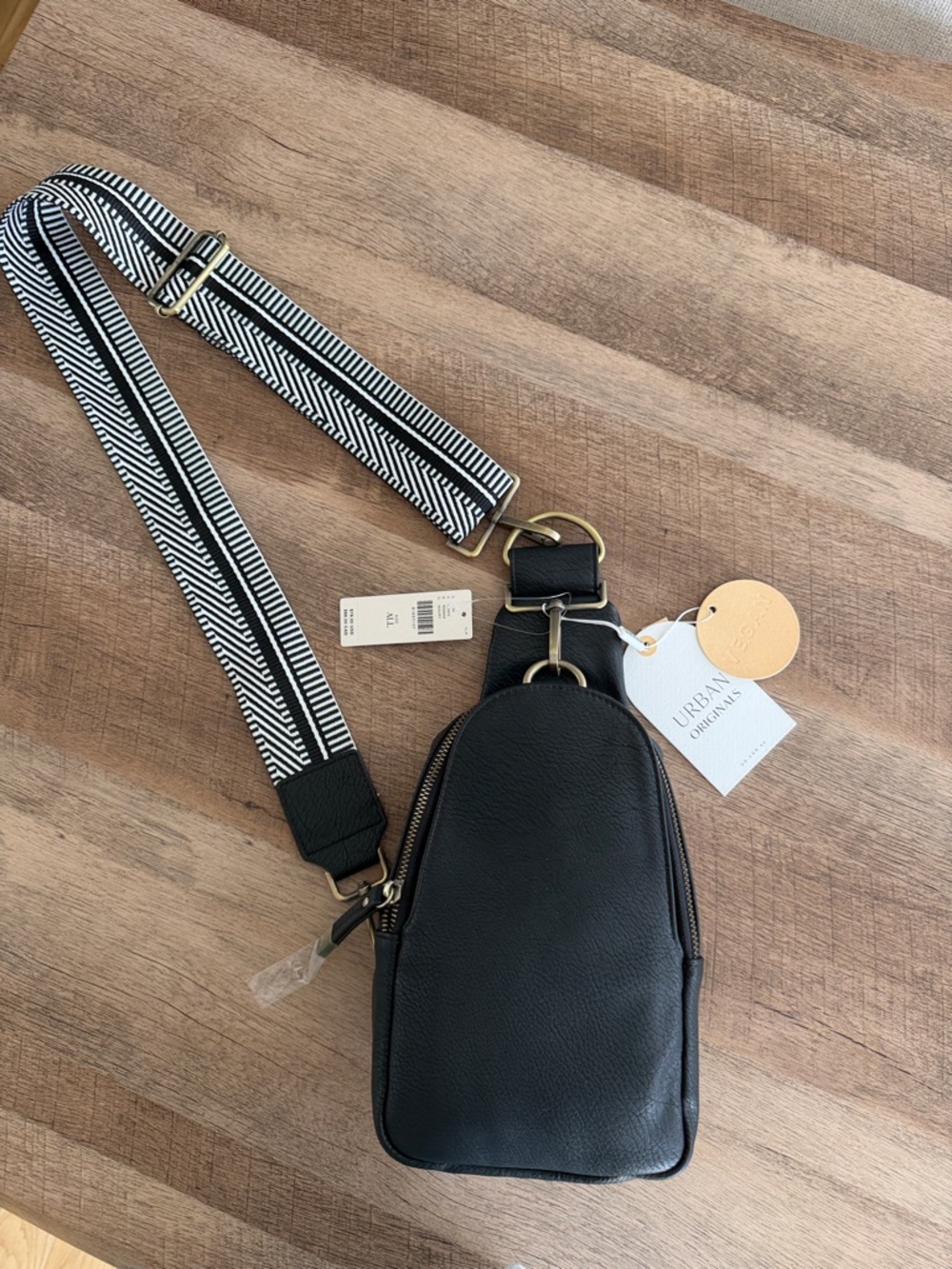 Urban Originals Black Faux Leather Sling Bag with Black & White Strap